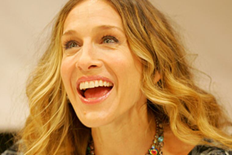 The former star of "Sex and the City" smiles during the event.