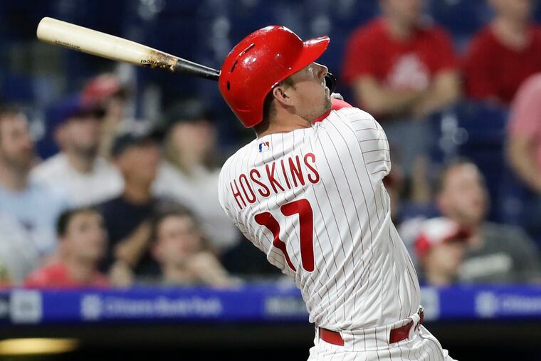 Rhys Hoskins watches his eighth-inning solo home run during the Phillies' 4-3 win against Washington on Monday.
