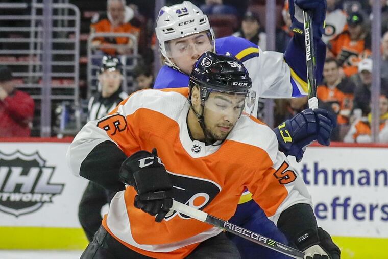 Philadelphia Flyers left wing Tyrell Goulbourne gets hit by St. Louis Blues center Ivan Barbashev during the teams’ recent meeting at the Wells Fargo Center.
