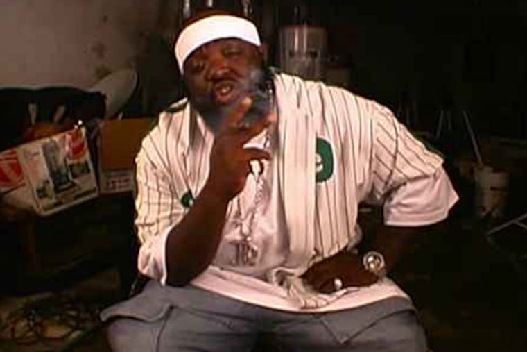 An indictment alleges that a city police officer tipped off drug kingpin Alton "Ace Capone" Coles (seen here in a still from a rap video), to impending raids of Coles' home and those of his top associates.