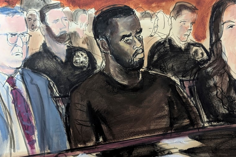 In this courtroom sketch, Sean Combs, center, is flanked by his defense attorney Marc Agnifilo, left, and Teny Garagos in Manhattan Federal Court on Tuesday, Sept. 17, 2024.