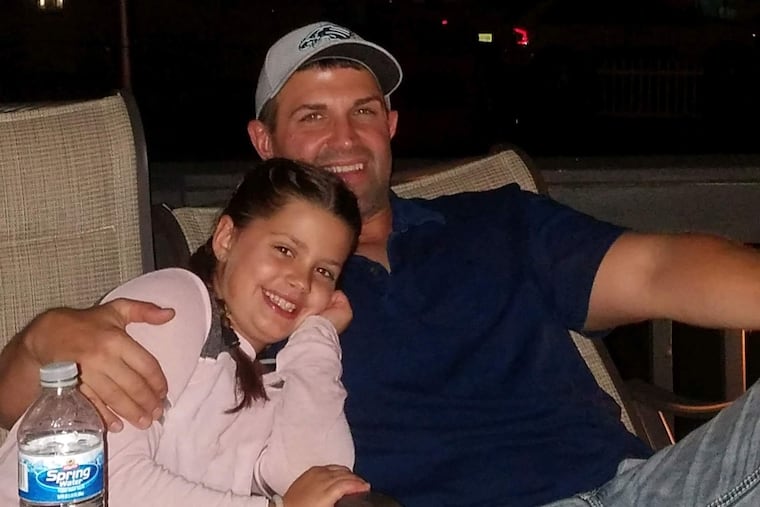 John Clausen, 46, of Gibbstown, N.J., with his daughter.