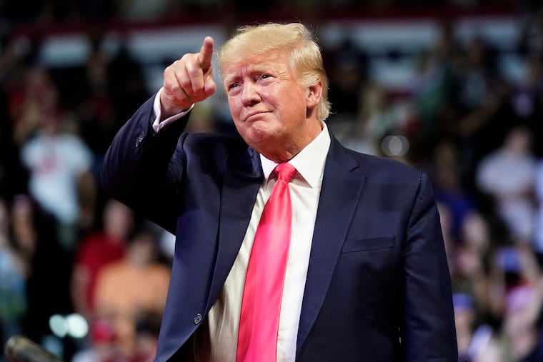 FILE - Former President Donald Trump points to the crowd as he arrives to speak at a rally July 22, 2022, in Prescott, Ariz. Trump is returning to Washington for the first time since leaving office to deliver a policy speech Tuesday night, July 26 before allies who have been crafting an agenda for a possible second term. Trump will address the America First Policy Institute's two-day America First Agenda Summit.
