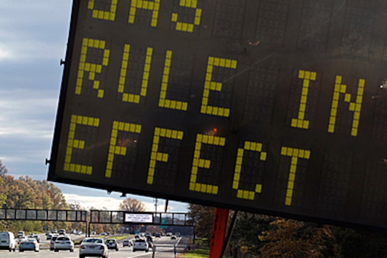 A sign is seen on the Garden State Parkway near Woodbridge, N.J., after a gas rationing system ordered by Gov. Christie went into effect at noon Saturday. Drivers with license plates ending in an even number will be allowed to buy gas on even-numbered days, and those with plates ending in an odd number can make gas purchases on odd-numbered days.