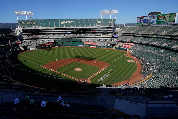 People watch a baseball game at Oakland Coliseum between the Oakland Athletics and the Texas Rangers in Oakland, Calif., in 2022.