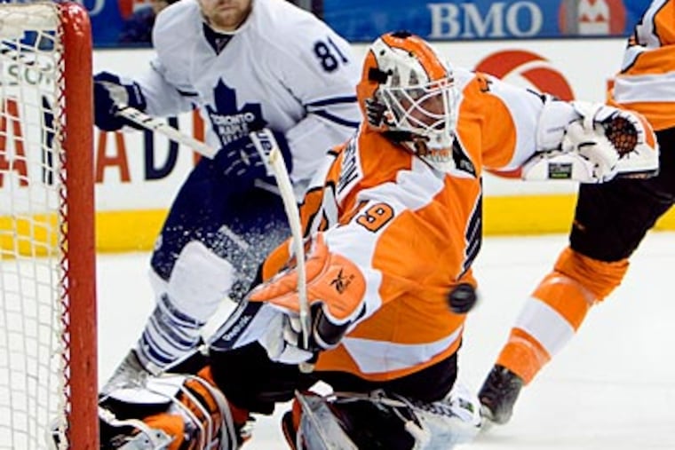 Maple Leafs center Phil Kessel (81) watches the puck get past Flyers goalie Michael Leighton. (Frank Gunn / AP Photo, The Canadian Press)