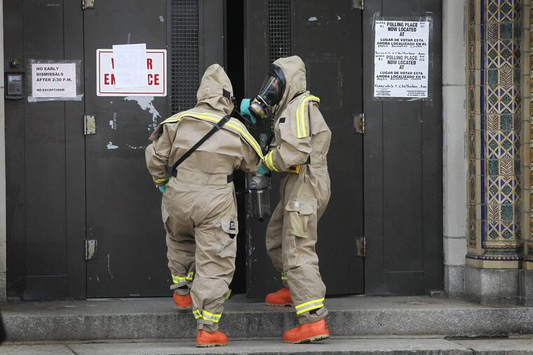 Philadelphia Fire Department Hazmat unit was at the James J. Sullivan Elementary School on Ditmas Street in Wissinomimg he city for a suspect hazardous material incident on Thursday morning April 19, 2012. The students from this school were taken to a neighboring school during the investigation. This picture shows haz-mat entering the school. ( ALEJANDRO A. ALVAREZ / STAFF PHOTOGRAPHER )
