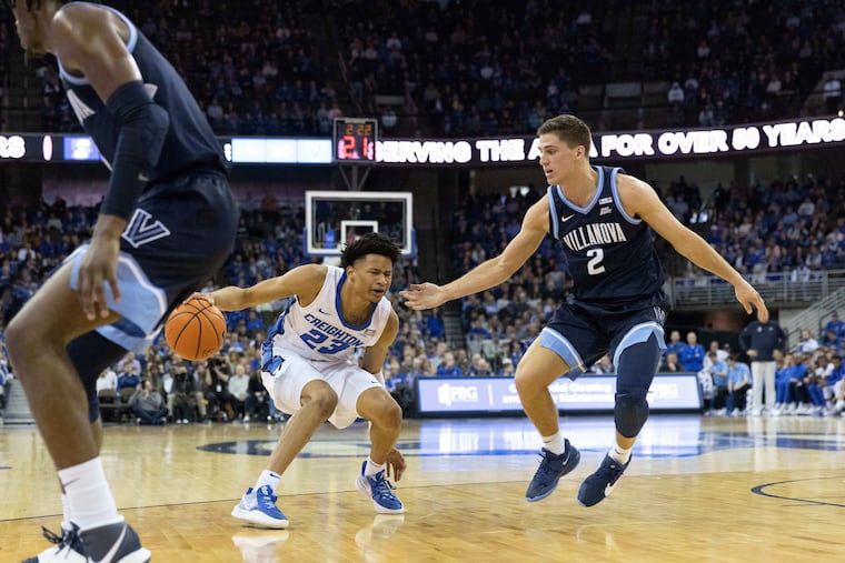 Villanova's Collin Gillespie (2) guards against Creighton's Trey Alexander (23) during the first half Friday night in Omaha, Neb.