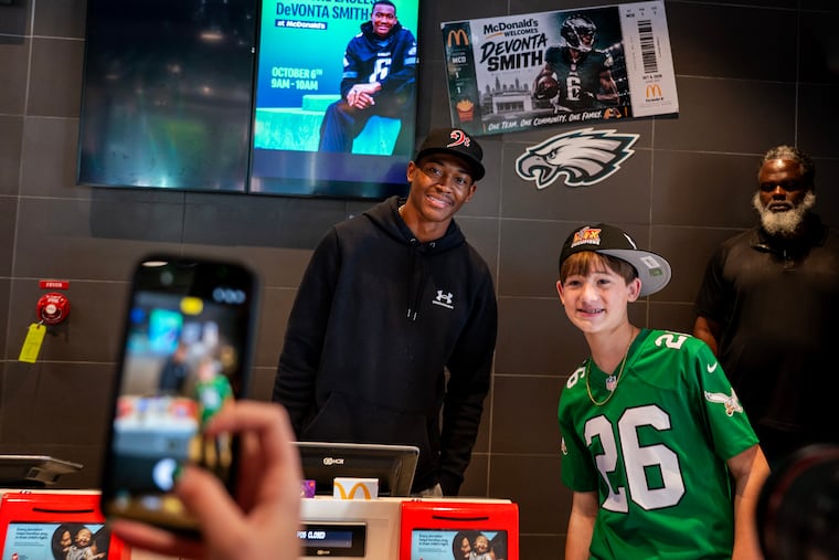 Eagles star wide receiver DeVonta Smith poses with fans at the McDonalds in Cherry Hill.