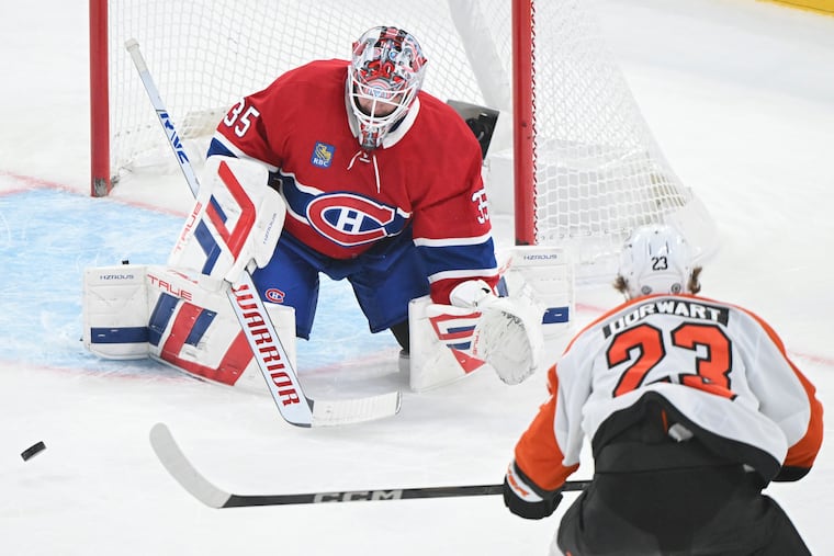 Montreal Canadiens goaltender Sam Montembeault stops a shot by Flyers rookie Karsen Dorwart during the first period Saturday.