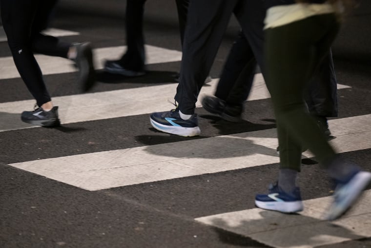MileUp diversion program participants run during an evening run on Kelly Drive.