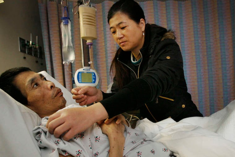 Jicun Wu, shown with wife Qinhui Chen, died March 15, after being confined to hospital beds for nearly two years following an attack.