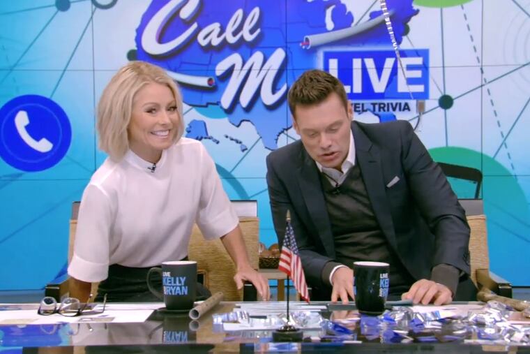 Kelly Ripa and Ryan Seacrest on the set of their show.
