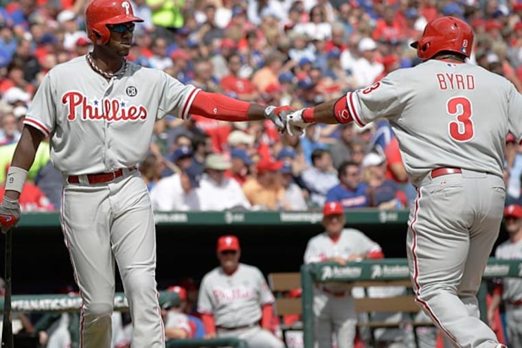The Phillies' Marlon Byrd celebrates his home run with Domonic Brown during the sixth inning. (Tony Gutierrez/AP)