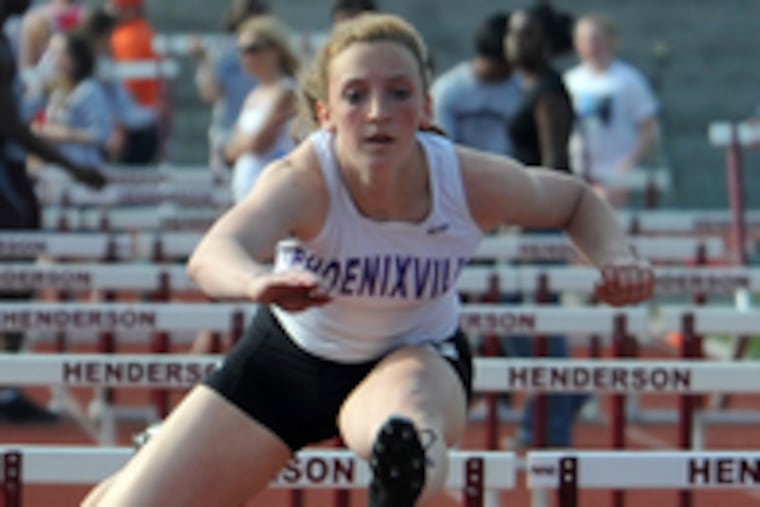 Phoenixville's Lauren Terstappen clears the last hurdle on her way to winning the 110-meter hurdles in 15.84 seconds.