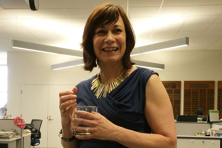 Saffron celebrating her Pulitzer with champagne. MICHAEL MERCANTI / Staff