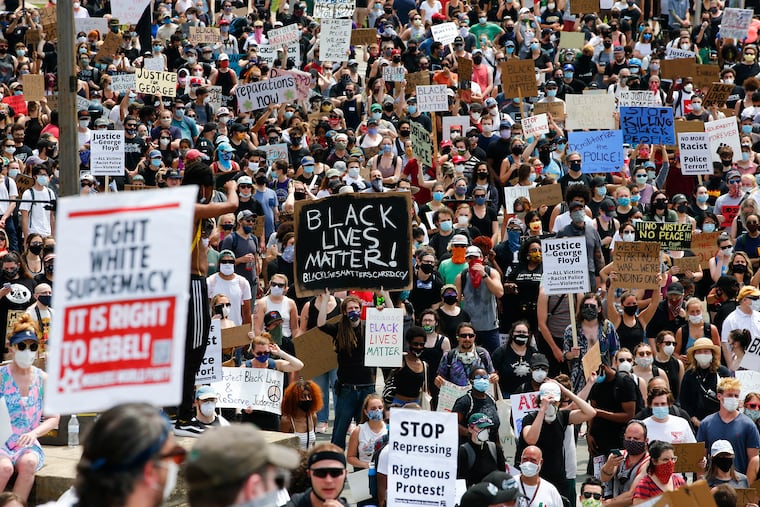 Demonstrators protest social injustice by the police at the Philadelphia Museum of Art along the Benjamin Franklin Parkway on Saturday, June 6, 2020.