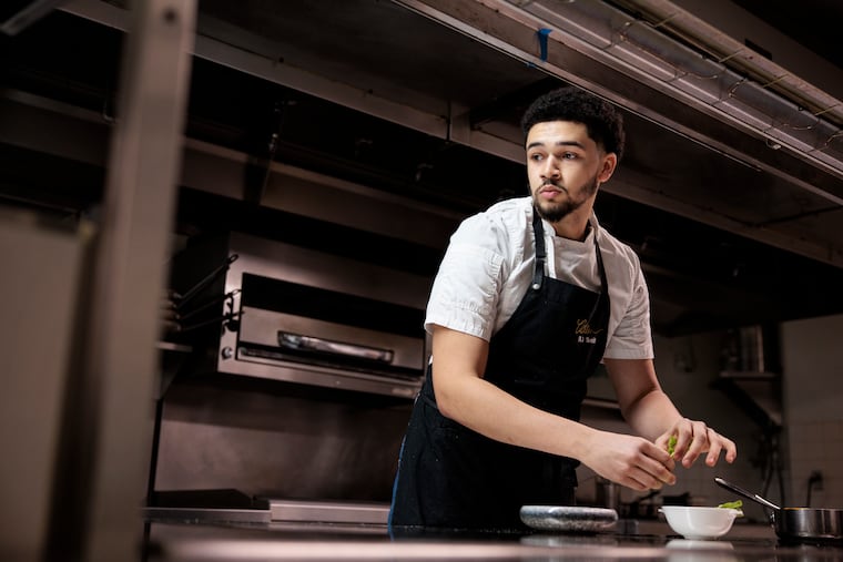 Chef RJ Smith plating dishes in the kitchen at the Rittenhouse Hotel on Jan. 21, 2026.