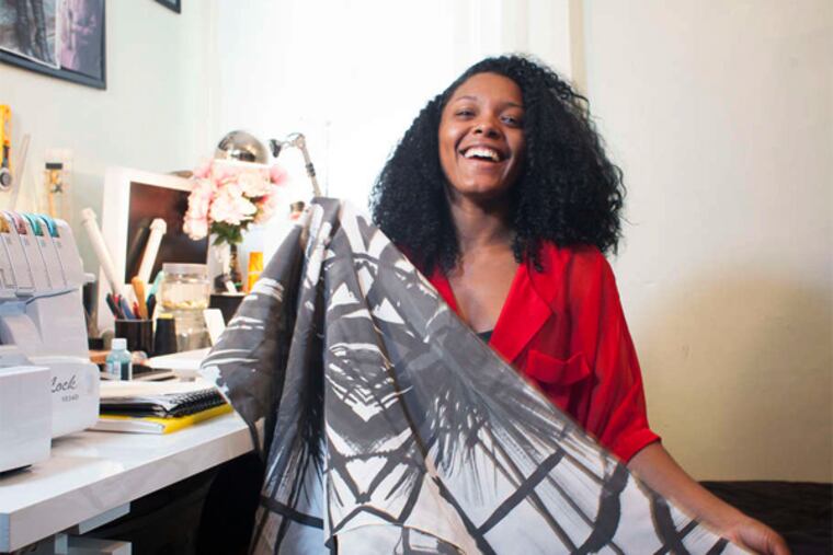 Overbrook's Dom Streater at home Sunday with a fabric sample.