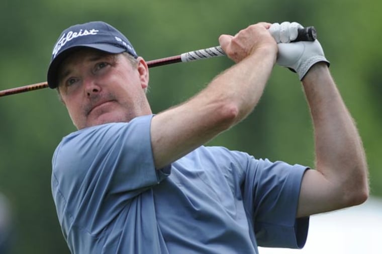 Geoffrey Sisk tees off on the second hole during the second day of practice for the US Open golf championship at Merion East golf course June 11, 2013. (Clem Murray/Staff Photographer)