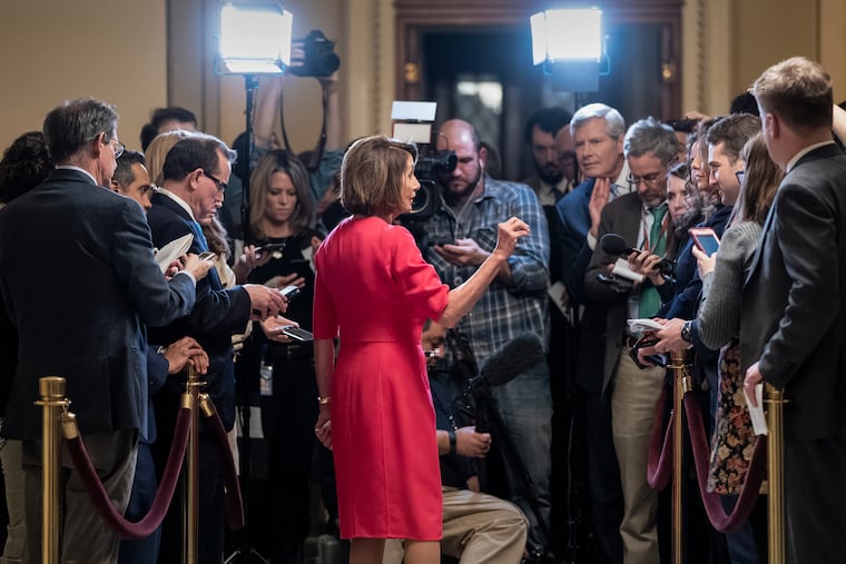 Speaker of the House Nancy Pelosi, D-Calif., center, pushes back on President Donald Trump's demand to fund a wall on the US-Mexico border with the partial government shutdown in its second week, during a news conference at the Capitol in Washington, Thursday, Jan. 3, 2019.