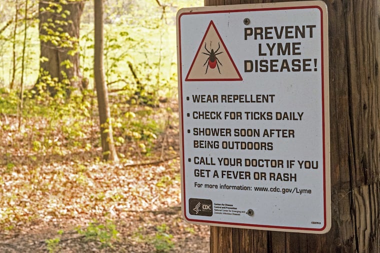 A trail-side warning from the Centers for Disease Control and Prevention about the prevention of tick-borne Lyme disease.