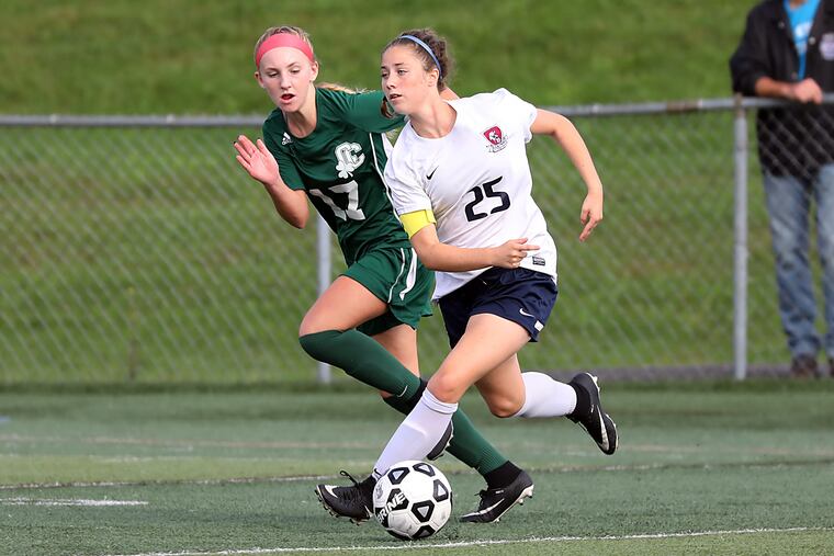 Eastern's Sara Brocious (right) chases the ball against Camden Catholic on Sept. 28.