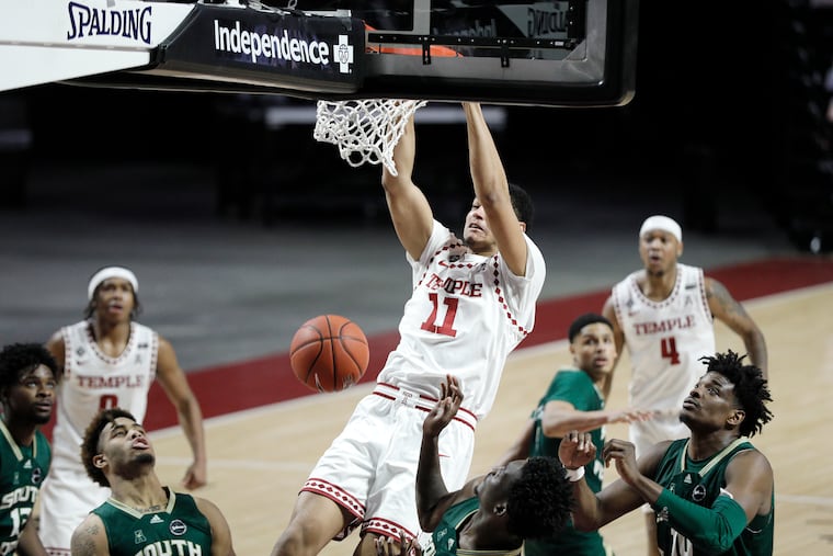Temple’s Nick Jourdain slams one on conference foe South Florida during a game last February. The men open their conference slate this year against East Carolina on Dec. 28.