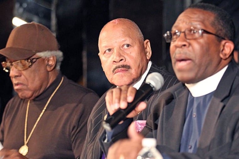 Sid Booker (from left), Donald “Ducky” Birts and the Rev. Elisha Morris hold a community meeting yesterday to air their grievances with J. Whyatt Mondesire.