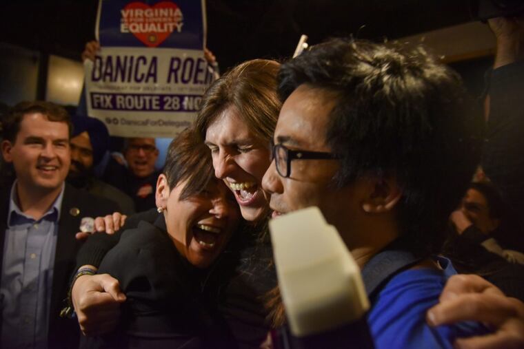 Danica Roem (center), a Democrat who ran for Virginia's House of Delegates against GOP incumbent Robert Marshall, is greeted by supporters as she prepares to give her victory speech on Nov. 7 in Manassas, Va.