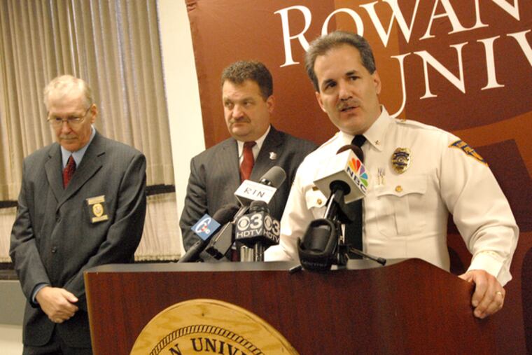 Glassboro Police Chief Alex Fanfarillo announces the arrests of three suspects in three armed robberies at Rowan University. With him are (at left) Timothy Michener, Rowan's assistant vice president for public safety, and Gloucester County Chief of Detectives Thomas Sullivan.