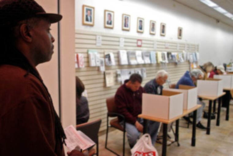 Charles Minor of Williamstown waits to cast his absentee ballot at the Gloucester County Store in the Deptford Mall. He said he wanted to be free on Election Day to "help the youth and senior citizens who don't have transportation to vote."
