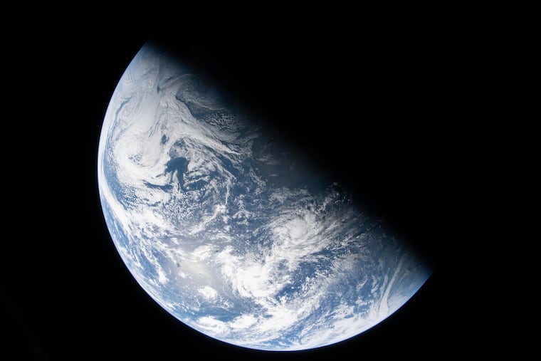 This image from video provided by NASA shows a view of earth taken by NASA astronaut and Artemis II Commander Reid Wiseman from one of the Orion spacecraft's four windows after completing the translunar injection burn, Thursday, April 2, 2026.