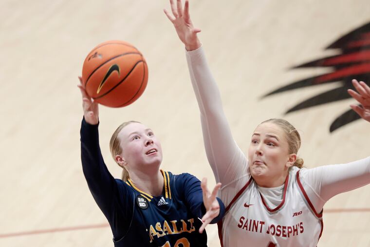 La Salle’s 13 Mia Jacobs (left), during a game against St. Joseph's earlier this season, had 17 points Saturday against St. Bonaventure.