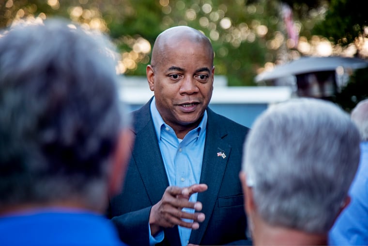 Tim Alexander speaks with voters at a Democratic Action Network LBI wine and cheese meet and greet in Surf City in October 2022. He is running in the 2nd Congressional District for the third time.