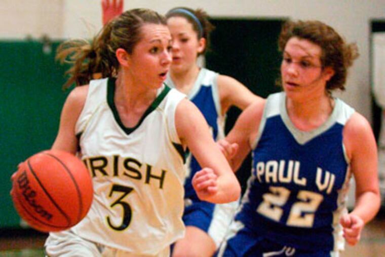 Camden Catholic's Nicole Angelo drives against Paul VI's Megan Harris.
(Ron Tarver / Staff Photographer)
