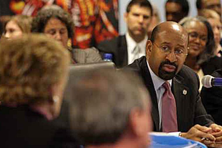 Mayor Nutter is floating a plan to raise property and sales taxes and cut services, among other things. Here, Nutter discusses the budget with council at a meeting last month.(Yong Kim / Staff Photographer)