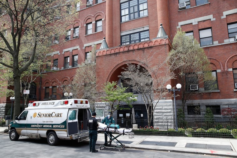 In this Friday, April 17, 2020, file photo, emergency medical workers arrive at Cobble Hill Health Center in the Brooklyn borough of New York. After two months and 10,000 deaths that have made the nation’s nursing homes the worst places to be during the coronavirus crisis, most of them still don’t have access to enough tests to help control outbreaks among their frail, elderly residents.