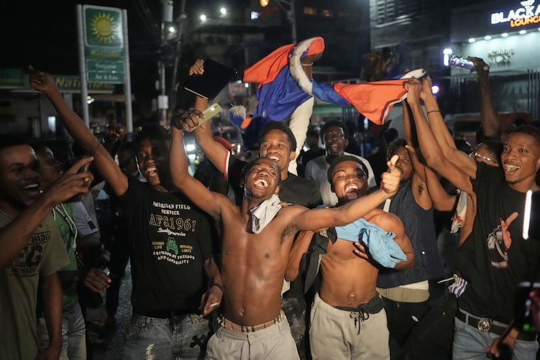 Fans celebrate Haiti defeating Nicaragua to qualify for the 2026 FIFA World Cup in Port-au-Prince, Haiti, in November.