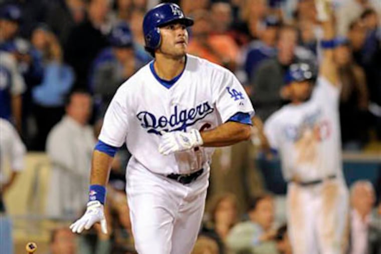 The Dodgers' Andre Ethier hits a game-wining RBI single against the Phillies during the ninth inning Friday in Los Angeles. (AP Photo / Mark J. Terrill)