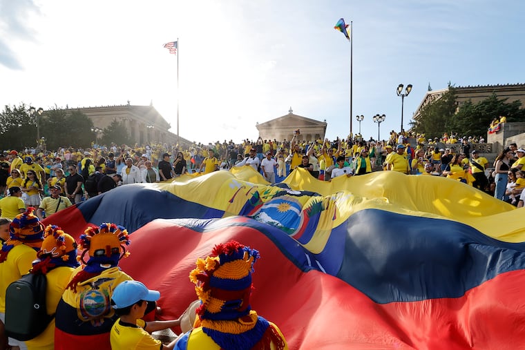 Ecuadorian soccer fans attend a flag waving event at the Philadelphia Museum of Art.