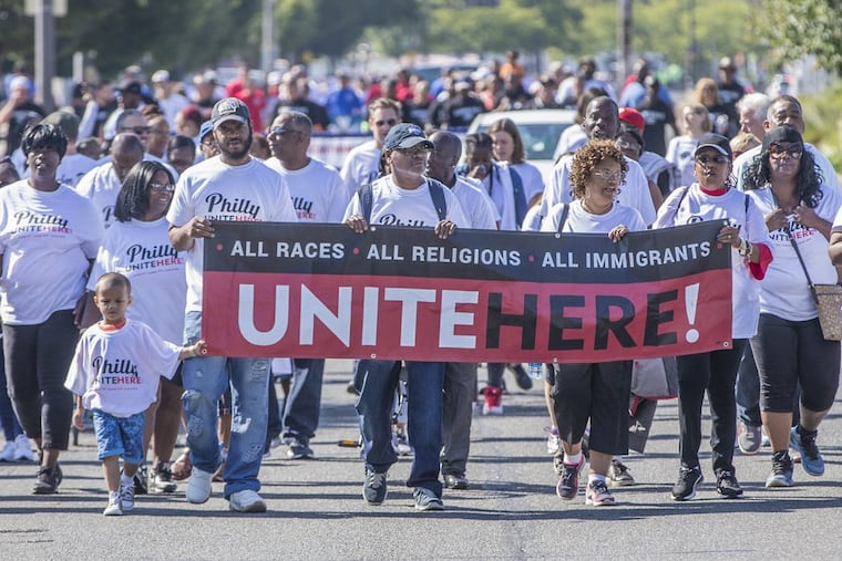 Philadelphia School District cafeteria workers, members of Unite Here, walk down Columbus Boulevard.