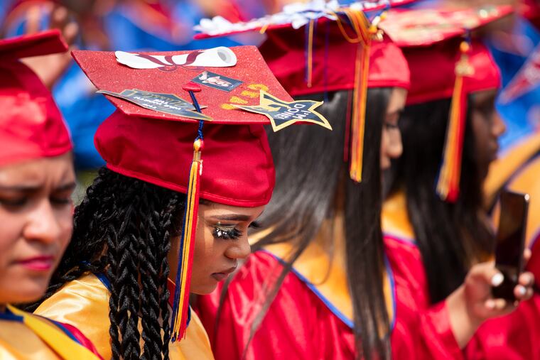 Makayla Cunningham listens during the Frankford High School class of 2022 graduation.