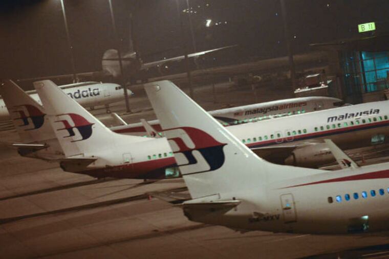 Malaysia Airlines , with majority ownership by Malaysia's government, has been struggling. (Joshua Paul / AP)