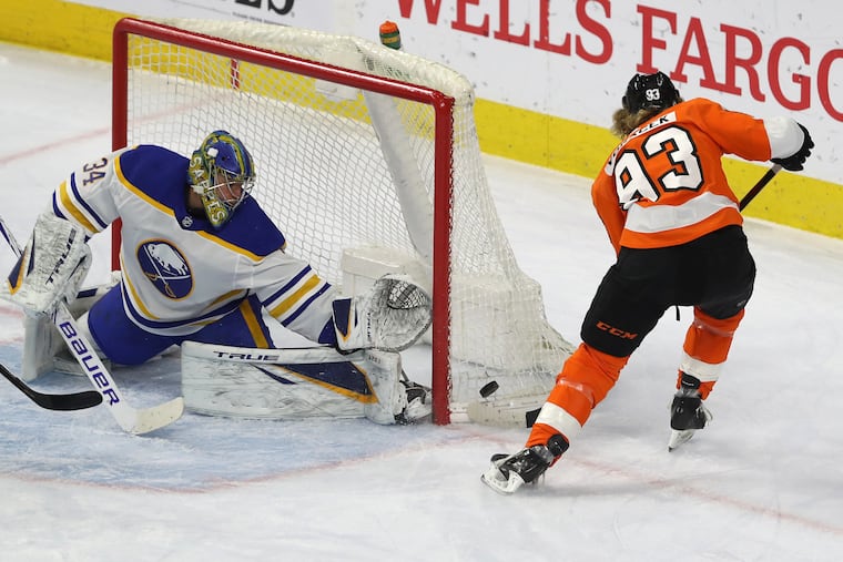 Buffalo goalie Jonas Johansson makes a great stop on the Flyers' Jake Voracek during the first period Tuesday.