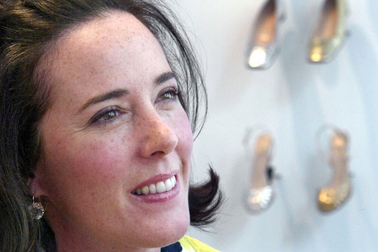 In this May 13, 2004 file photo, designer Kate Spade poses with shoes from her next collection in New York. Law enforcement officials say Tuesday, June 5, 2018, that New York fashion designer Kate Spade has been found dead in her apartment in an apparent suicide.