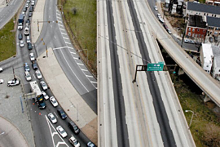 Interstate 95 through Philadelphia last week became the latest
symbol of the nation’s rapidly failing bridges and highways. (Eric Mencher/Inquirer)