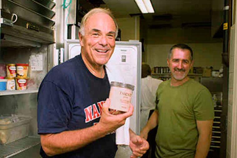 Ed Rendell shows governor's mansion executive chef Barry Crumlich a stash of his favorite treat: Tahitian vanilla bean gelato by Talenti. (Ed Hille/Staff)