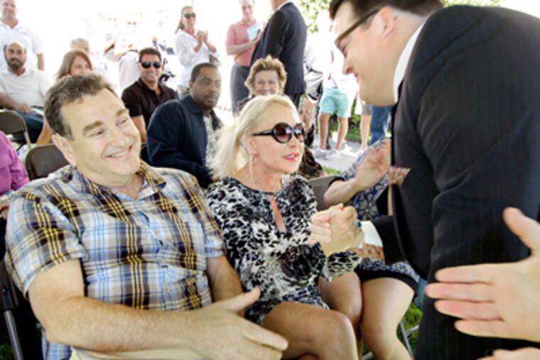 After buying the archdiocesan property in Ventnor, Steve and Irene Berger of Newtown Square are congratulated by Glen McDonald of Max Spann auctions. (Elizabeth Robertson / Staff Photographer)