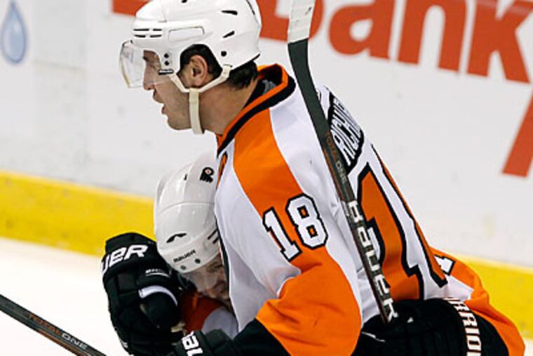 "I thought it was a good road win for us," Flyers coach Peter Laviolette said. (AP photo)